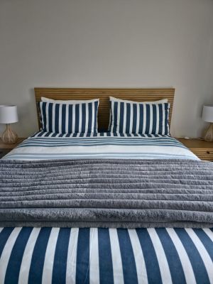 queen-sized bed with side tables